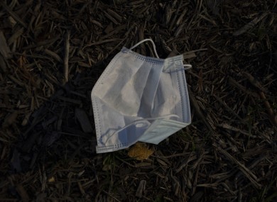 A discarded mask on the ground. Don't do this.