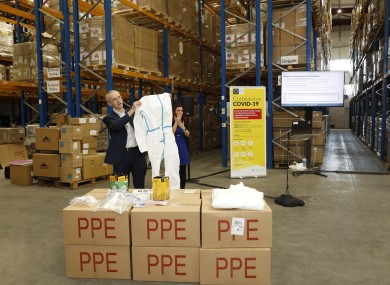 Professor Martin Cormican displaying some of the PPE equipment sourced from China,