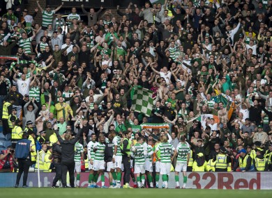 Celtic players and their fans (file photo)