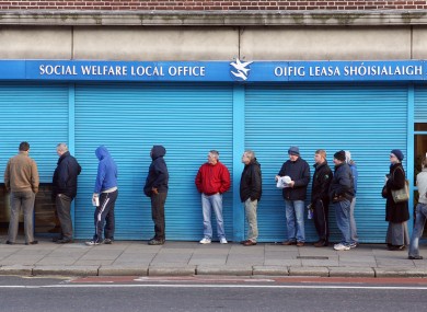 People queue outside a social welfare office in Dublin during the last crisis in 2009