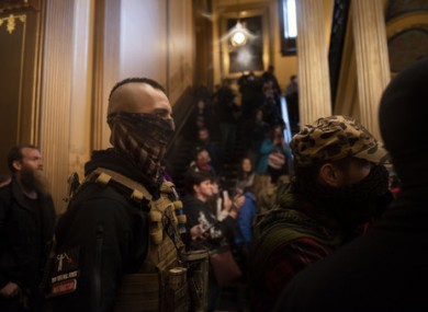 Protesters congregate inside the Capitol Building in Michigan.