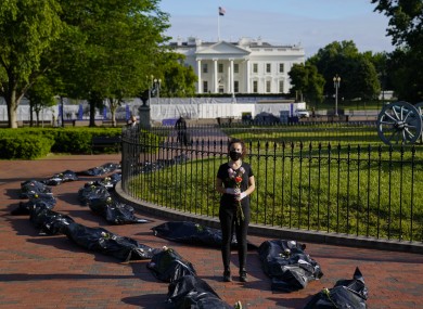 Margot Bloch from Maryland participates in a protest over President Trump's handling go the coronavirus pandemic.