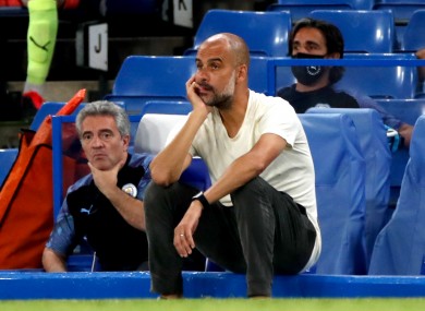 Pep Guardiola looks on as his side slips to defeat at Chelsea.