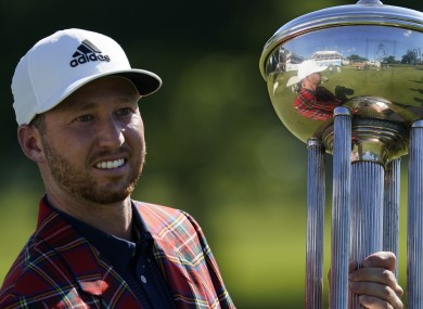 Daniel Berger poses with the championship trophy.