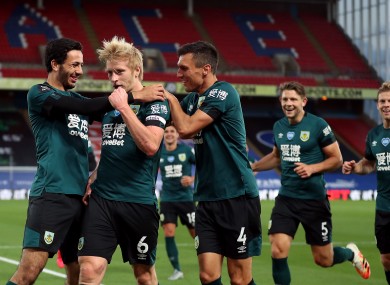 Burnley's Ben Mee celebrates scoring the only goal of the game.