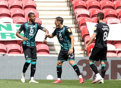 Swansea City's Rhian Brewster (left) celebrates scoring his side's first goal of the game.