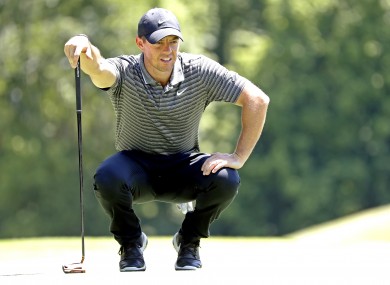Rory McIlroy lines up his putt on the eighth green during the second round of the Charles Schwab Challenge golf tournament.