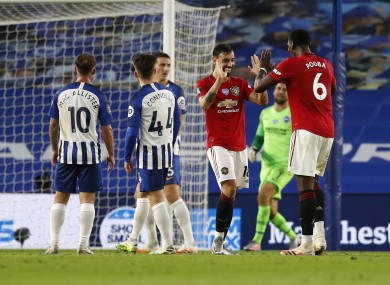 Bruno Fernandes celebrates scoring United's second goal with Paul Pogba.