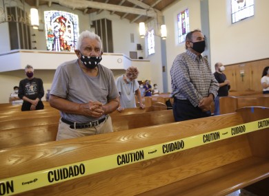 People pray in a California church on Sunday.