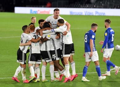 Fulham's Josh Onomah is mobbed by team-mates after scoring his side's second goal against Cardiff City.