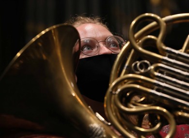French horn player Hannah Miller is pictured rehearsing ahead of tonight's concert.