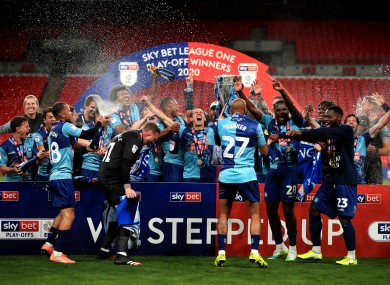 Wycombe Wanderers celebrate with the trophy.