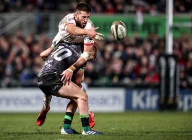 Stuart McCloskey is tackled by Conor Fitzgerald in December.
