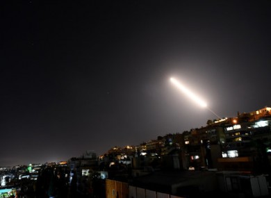 Syrian air defense missiles in the sky over Damascus.