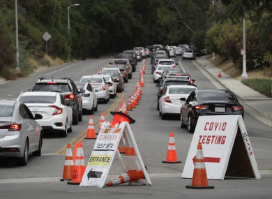 Motorists line up at a coronavirus testing site at Dodger Stadium in Los Angeles