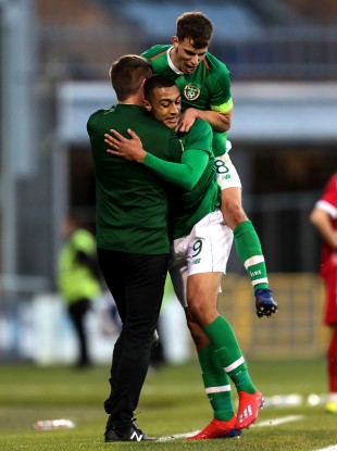 Adam Idah and Jayson Molumby embrace Stephen Kenny after Idah's goal against Luxembourg in an U21s Euro qualifier last year.