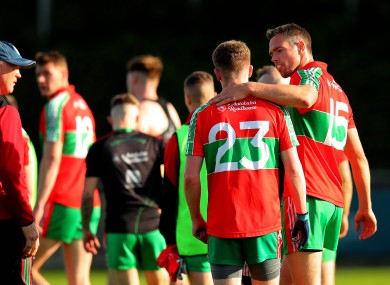 Ballymun Kickhams' Andrew McCaul celebrates with Dean Rock after the game.