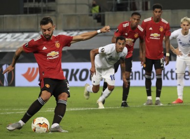 Manchester United's Bruno Fernandes scores from a penalty kick.