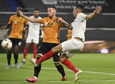 Matt Doherty battles with the goalscorer, Lucas Ocampos.