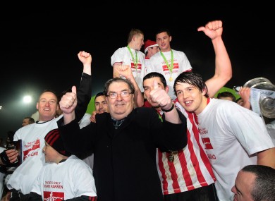 John Hume celebrating with the Derry City team after they won the League of Ireland First Division title in 2010.