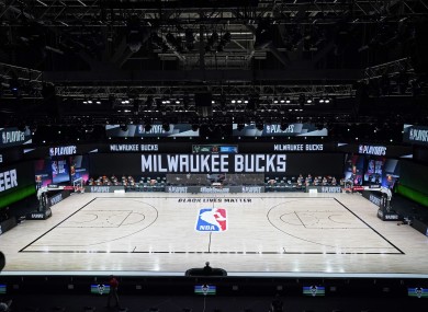 The court and benches are empty of players and coaches at the scheduled start of an NBA basketball first round playoff game between the Milwaukee Bucks and the Orlando Magic,