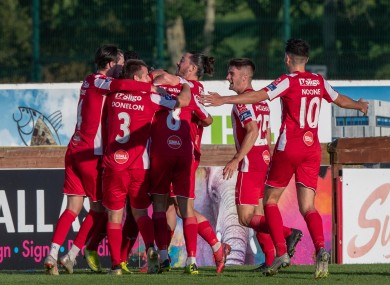 Sligo Rovers’ players congratulate Alex Cooper after scoring a late winner against Waterford.