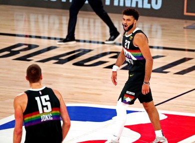 Denver Nuggets guard Jamal Murray (27) reacts with center Nikola Jokic (15) during the fourth quarter against the LA Clippers.
