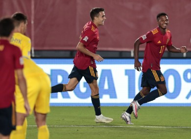 Spain's Ansu Fati, right, celebrates after scoring.