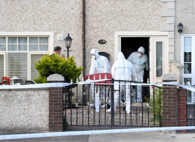Pictured are garda forensics teams (technical bureau) removing the body from the scene in Croftwood Park in Ballyfermot, 27 July.