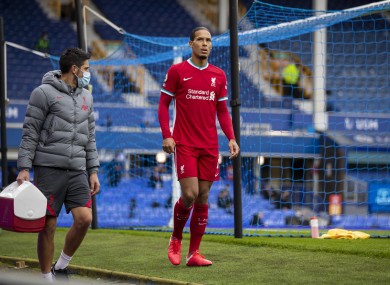 Virgil van Dijk limps off during the Merseyside derby.