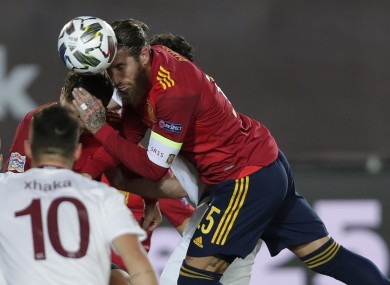 Spain's Sergio Ramos wins a header.