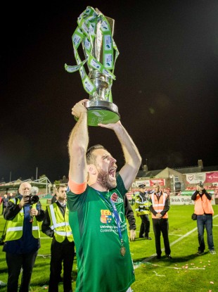 Bennett lifting the league trophy in 2017.