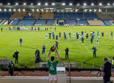 Declan Hannon raises the Munster senior hurling trophy.