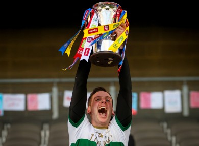 Captain Conor Sweeney lifts the cup after Tipperary's victory.