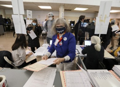 Worker at a polling station in New York.