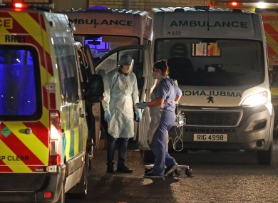Medical staff attending to two patients in an ambulance, at Antrim Area Hospital in Northern Ireland