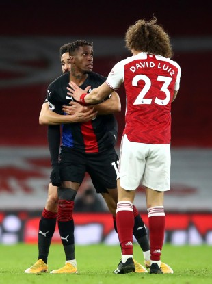 Crystal Palace's Wilfried Zaha (left) and Arsenal's David Luiz.