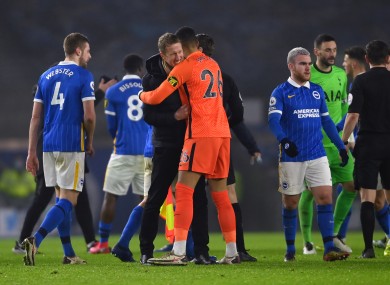 Brighton players celebrate after the full-time whistle.