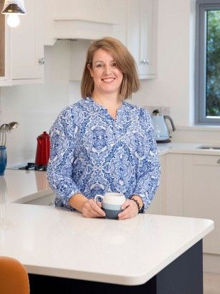 Janette in her bright and spacious new kitchen