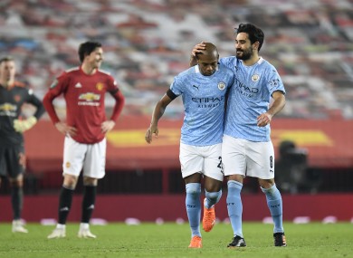 Fernandinho is congratulated by Ilkay Gundogan after scoring for Manchester City at Old Trafford.