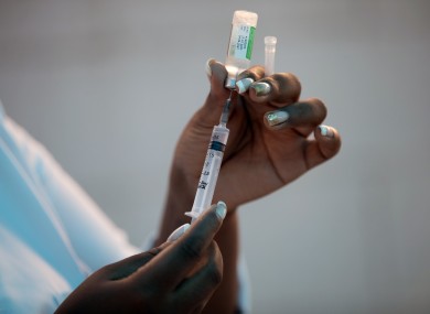 A healthcare worker prepares a dose of the Oxford-AstraZeneca vaccine in Rio, Brazil.
