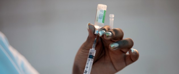 A healthcare worker prepares a dose of the Oxford-AstraZeneca vaccine in Rio, Brazil.
