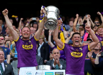 Wexford joint captains Matthew O'Hanlon and Lee Chin lift the Bob O'Keeffe Cup in 2019.