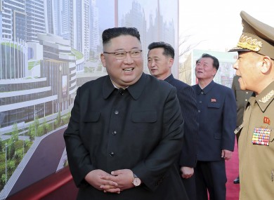 In this photo provided by the North Korean government, North Korean leader Kim Jong Un, center, attends a ceremony to break ground for building 10,000 homes, in Pyongyang, Tuesday.