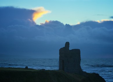 Stormy skies beyond the castle ruin at Ballybunion, Co. Kerry (file).