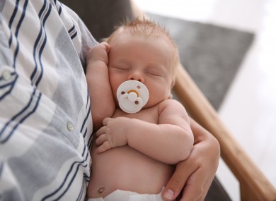 File photo of a mother holding a baby