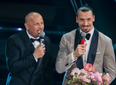 Zlatan Ibrahimovic and Sinisa Mihajlovic signing on stage.