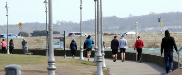 People walking on the seafront at Clontarf in Dublin last month.