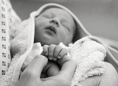 File photo of a woman holding a baby