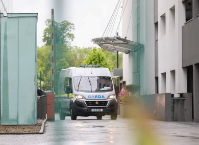 A garda van arrives carrying Daniel Goulding at Blanchardstown District Court.